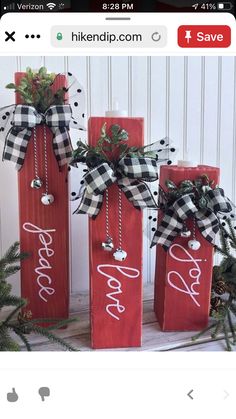 three red wooden christmas bags with black and white ribbon tied around the handles that say happy new year