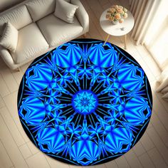 a blue circular rug in the middle of a living room with a couch and table