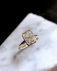 a close up of a ring on a marble surface