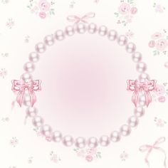 a pink and white frame with pearls, bows and flowers on it's sides