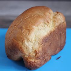 a loaf of bread sitting on top of a blue surface