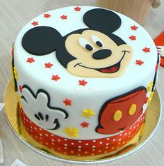 a mickey mouse birthday cake on a table