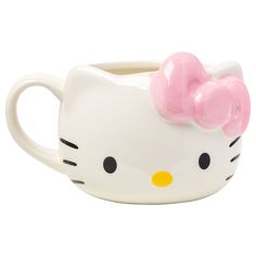 a white hello kitty mug with a pink bow on it's head and eyes