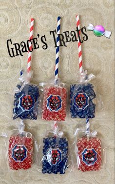 four red, white and blue treats in plastic bags