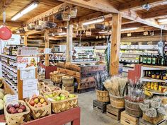 the inside of a grocery store filled with lots of fresh produce