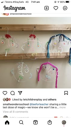 the tweets are hanging on the wall in front of the window, which is decorated with string