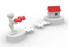 a person holding a piece of red puzzle in front of a house on top of two white pieces