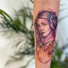 a woman's arm with a star wars tattoo on it