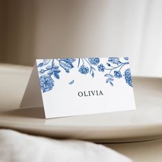 a place card sitting on top of a white plate