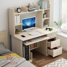 a desk with a computer on top of it in a room next to a window