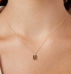 "14K SOLID YELLOW GOLD DAINTY INITIAL NECKLACE WITH DIAMONDS Metal : 14K Solid Gold Necklace Length : 16 inches / 40cm Letter Height : 9.00mm Letter Width : 6.55mm ---MADE IN USA--- ---All letters from A to Z are available. Please indicate your letter choice in the \"notes to seller\" section on the order. ---This is a beautiful 14K Solid White Gold Dainty Initial Necklace with Diamonds. Available White Gold -Yellow Gold or Rose Gold ---Absolutely stunning. Comes in a gift box. ---Shipping Polic Letter M Necklace, Initial Necklace Gold Letters, M Necklace, Gold Initial Necklace, Dainty Initial Necklace, Evil Eye Necklace Gold, Diamond Initial Necklace, Gold Letter Necklace, Solid Gold Necklace