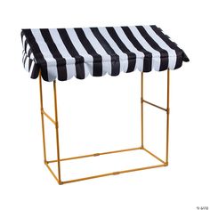 a black and white striped awning on a gold frame stand with an open top