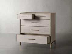 a white dresser sitting on top of a gray floor