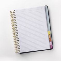 an open notebook with colored notes on it