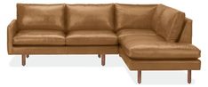 a brown leather sectional sofa with chaise lounge and footstool, viewed from the front