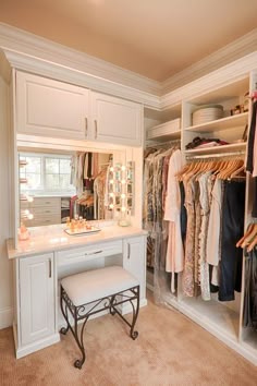 an organized closet with clothes, shoes and other items in it's storage area