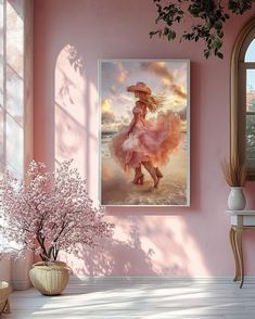 a pink room with a painting on the wall