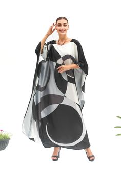 A full length kaftan plus size featured with minimalist abstract  will bring the elegant vibe of Spring and perfect for holiday occasions or any occasion you attend. The fabric is blended silk with more than 80% silk so the care is more easier with washing and iron, in addition less wrinkles. It's totally smoothly flowy, soft and gentle touch. FEATURES - Circles and Round abstract print - Black, White, Gray Tones - Personal Custom Made - Full Length Kaftan Half-Sleeves - Designer Silk Kaftan - Plus Size and Custom Length - Resort Wear, Beach Wear, Lounge Wear, Pool Cover Up Kaftan - Boat Neck -------------------------------- DETAIL  * The size can be adjusted to fit up to 5 XL. Bust/ Waist/ Hip up to 50 inches ( 100 inches full circumference)  * Length of the kaftan could be max. 55 inches Night Gown Black, Black Kaftan, Custom Made Dress, Gown Black, Made Dress, Silk Kaftan, Gray Tones, Hip Ups, Dress Silk