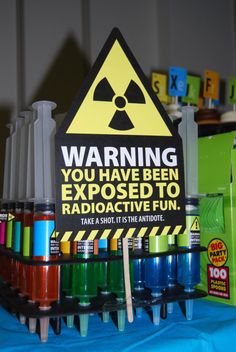 a sign warning you have been exposed to radioactive fun on a table with other items