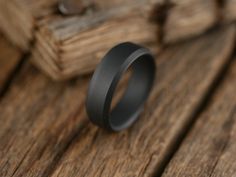 About This Ring The Singularity ring is constructed from solid grade 5 titanium for the ultimate in lightweight performance, then given an awesome matte black finish. Perfect for those who don't like traditional polished finishes! Free shipping in the USA! Every Richter Scale ring is covered by our 100% Guarantee Details Resizing This ring can be resized UP ONLY as much as 1 full size Materials Titanium Finish Matte Black Care instructions Clean with mild soap and water as needed. Fit Comfort fi Richter Scale, The Singularity, Black Titanium Ring, Titanium Ring, Wedding 2025, Black Plain, Plain Bands, Grade 5, Titanium Rings