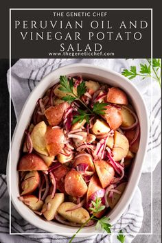 a white bowl filled with potatoes and red onions next to a napkin on top of a table