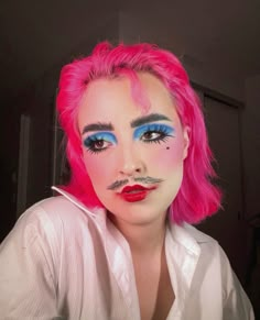 fun recreation of a tiktok makeup filter, blue editorial makeup, blue eyeshadow, moustache makeup, drag king, messy makeup, pink hair, androgynous makeup, red lipstick, clown core Colorful Drag Makeup, Pink Red Makeup Looks, Clown Drag Makeup, Blue Drag Makeup, Pink Drag Makeup, Hot Pink Makeup Looks