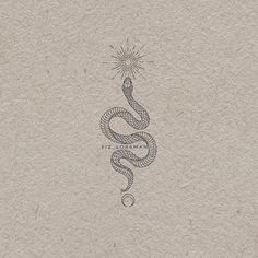 a drawing of a snake on top of a piece of paper with a light bulb above it