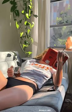 a woman laying on top of a bed next to a window with a book in her lap