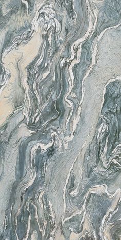 an abstract marble pattern in grey and beige colors with white streaks on the top right side