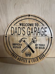 a wooden sign that says, welcome to dad's garage service and repair my tools