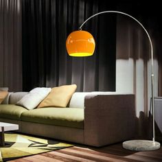 a living room filled with furniture and a lamp