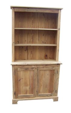 a wooden bookcase with two doors and drawers