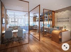 an office with wooden floors and glass partitions on the wall, surrounded by white chairs