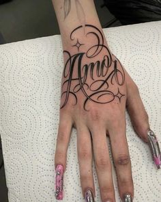 a woman's hand with her name tattooed on it