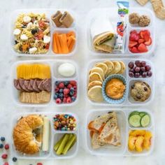 a plastic container filled with lots of different types of foods and veggie trays