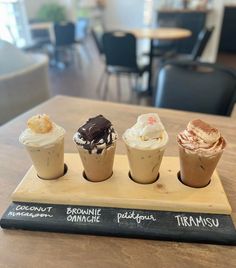 three different types of ice cream on a wooden tray