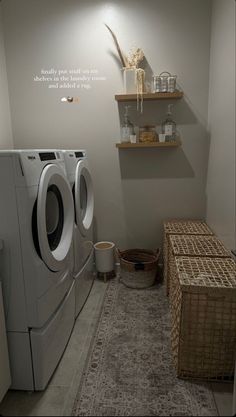 a washer and dryer sitting in a room next to a shelf filled with items