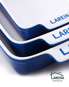 three blue and white plates sitting on top of each other with the words larrira written on them