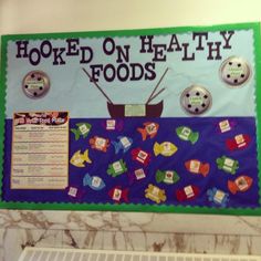 a bulletin board that says hooked on healthy foods