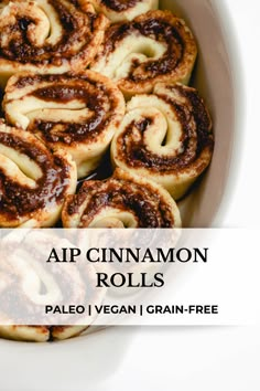 cinnamon rolls in a white bowl with text overlay reading app cinnamon rolls pale vegan i grain - free