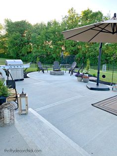 an outdoor patio with chairs and umbrellas