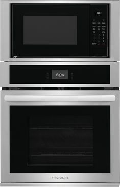 two ovens side by side with the door open