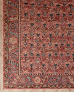 an old rug with red and blue colors