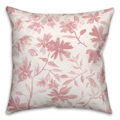 a pink and white pillow with flowers on it