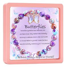 a pink and purple bracelet with butterflies on it, in front of a card saying be brave always believe in yourself