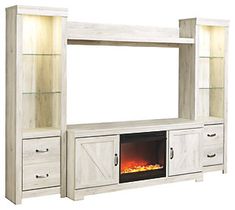 an entertainment center with a fireplace in it