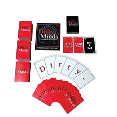 the card game dirty minds is set up on a white surface with red cards and matching dices