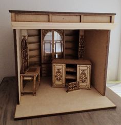 a doll house with furniture inside of it