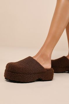 You'll be the style icon of sweater weather season with some help from the Lulus Flannerie Dark Brown Faux Fur Platform Mules! These slipper-style mules feature fuzzy faux fur that shapes a clog-inspired silhouette with a rounded-toe upper and a low-cut collar, atop a 1.5"" toe platform. The simple slide-on design is perfect for effortless styling, while a chunky block heel completes the look! 2" platform heel. Lightly cushioned insole. Rubber sole has nonskid markings. Man Made MaterialsImported. Lulus | Flannerie Dark Brown Faux Fur Platform Mules | Size 5.5. Platform Mules, Weather Seasons, Chunky Block Heels, Platform Heel, Sweater Weather, Platform Heels, Style Icon, Low Cut, Block Heels