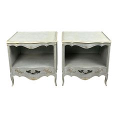 pair of french bedside tables with painted details